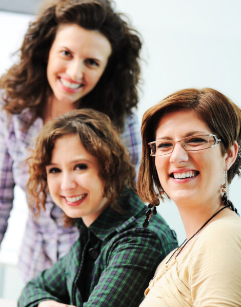 Meet the dedicated team at Kogan Communications & Design: three smiling women representing experience, reliability, and personalized service.